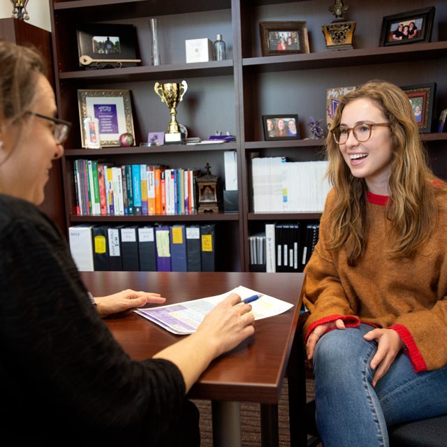 Student talking with an advisor